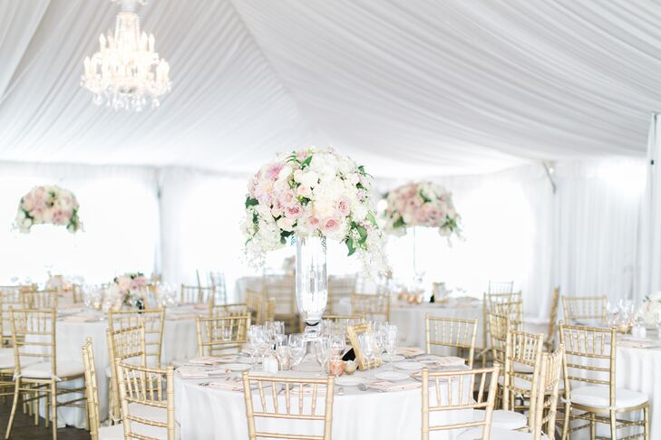 Inside the white tent, gold accents, chandeliers and candlelight created a romantic glow. Keen on keeping the guests entertained, Bree and Greg had the tent open onto a grassy area "all night, so our guests could socialize under the summer stars."