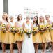 The bridesmaids wore knee-length yellow and white dresses for the retro homespun barn wedding. Katie loved the flowing tulle skirts and chic lace bodices. Each of the women chose their own nude shoes and their hairstyle for the day for a little personalization on the otherwise uniform look.