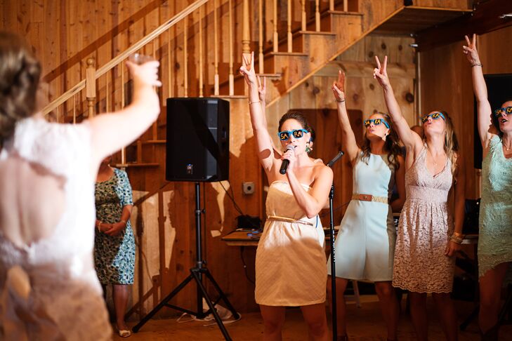 Sara's bridesmaids surprised her with a karaoke performance during the reception.