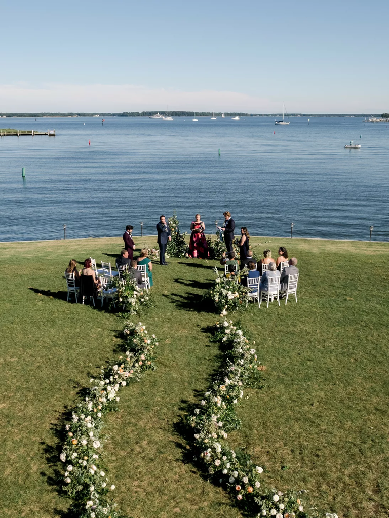 Lead guests to your ceremony with a snaking row of verdant flowers.