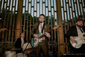 Groom Playing Guitar With High School Band at Retro Wedding Reception
