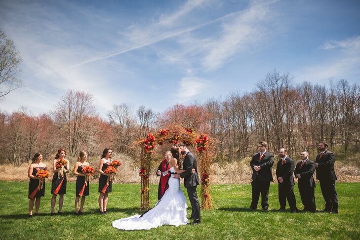 “I tried to keep a vintage, elegant look to go with the feel of the barn,” Ashley says. What she chose was completely unexpected. She picked out a white trumpet-style Maggie Sottero dress from Arlene’s Bridal Salon with cascading ruffles along the skirt, ruche detailing and a bold, black beaded sash across her waist.