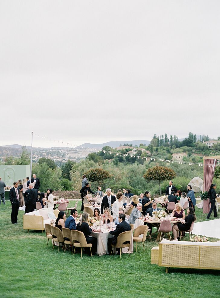 Outdoor Reception, Guests at Long Dining Tables, Mingling Under String Lights