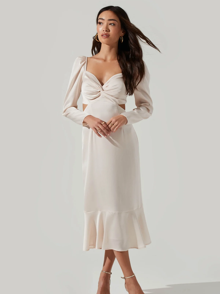 A model wears this lovely white calf-length gown with a keyhole waist.