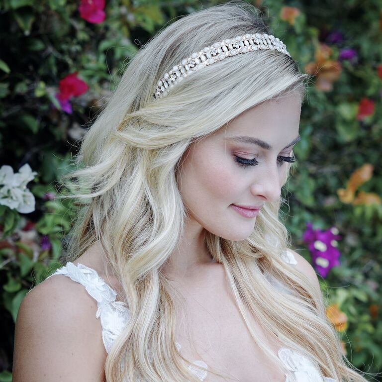 Model wears a chic rhinestone headband. 