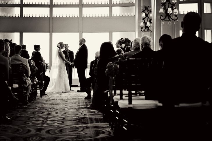 The ceremony was held in the Boston Harbor Hotel’s Warf Room, a modern space with floor-to-ceiling windows overlooking Boston Harbor. The couple kept the decor on the more minimal side, adding a few pops of color to the elegant room with bunches of fresh pink hydrangeas lining the aisle. The pair walked down the aisle to a selection of classical tunes, including “Ave Maria,” Kenny G’s “Wedding Song,” and “Canon in D,” kicking things up a notch for the recessional with Stevie Wonder’s “Signed, Sealed, Delivered.”