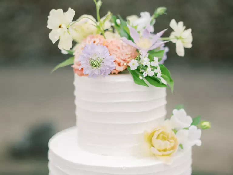 All-White Wedding Cake With Pastel Flowers