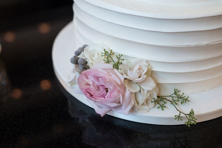 The couple incorporated their colors throughout the space and food -- including gray and white floral details on their wedding cake!
