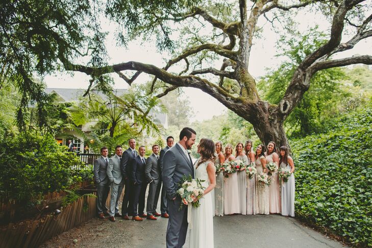 Groomsmen wore gray suits of their choosing, while bridesmaids selected full-length gowns in varying shades of blush, gray or ivory. Instead of a veil, Crystal wore a Jennifer Behr comb that tied in with the relaxed setting at Sand Rock Farm Bed and Breakfast in Aptos, California.
