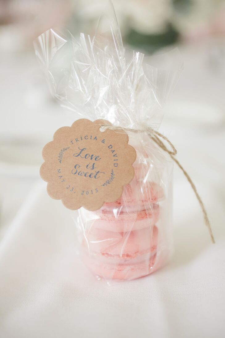 In keeping with the pale pink color scheme, guests took home little bags of raspberry macarons.
