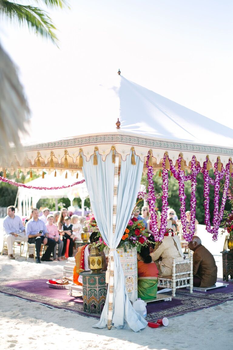 Tented mandap with purple orchid garlands