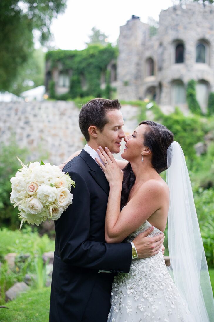 "Initially, I was going to wear my hair up to show off the back of the dress but I changed my mind the day of the wedding," says Ashley. She chose to wear her hair down and to the side, draped over one shoulder.