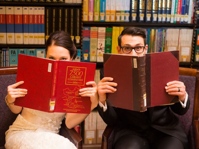 couple posing with books