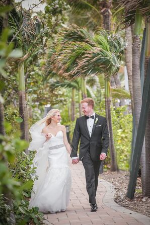Bride and Groom Walk Along Tropical Venue