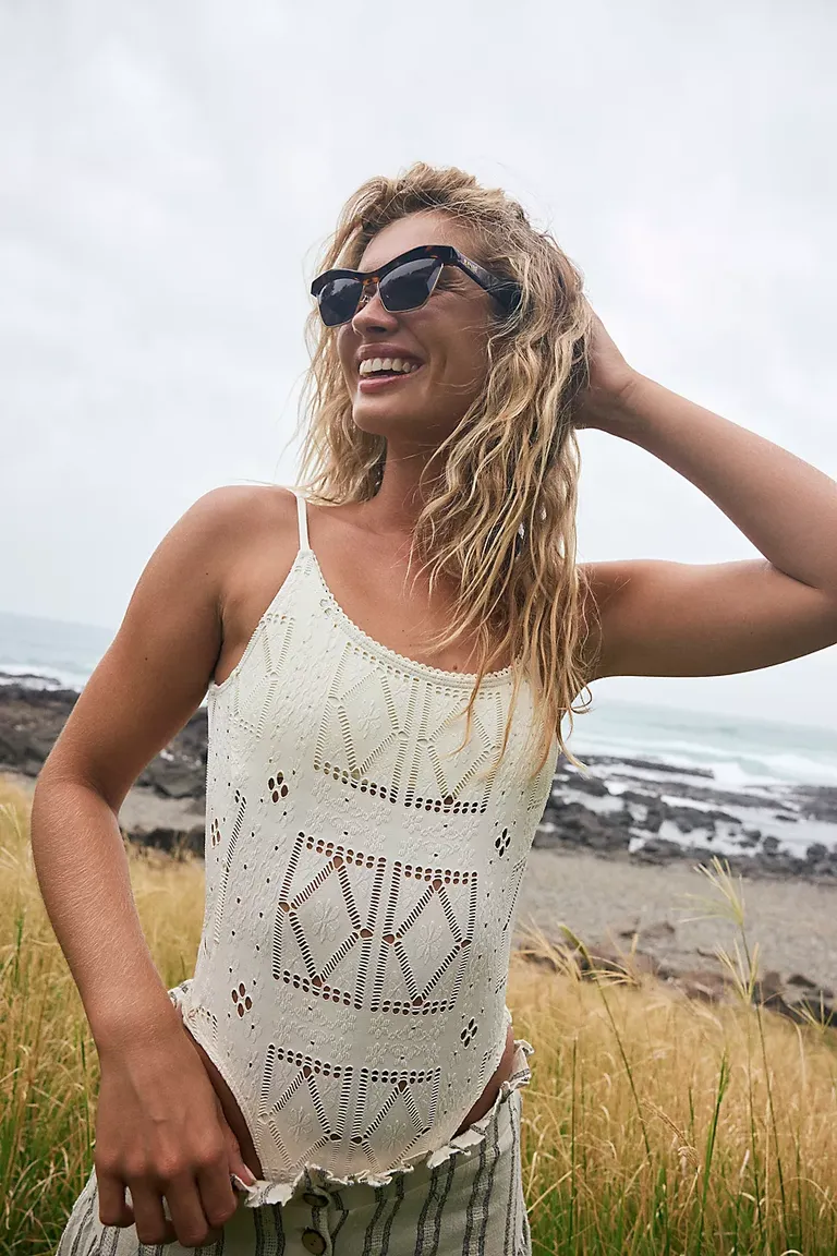 white one piece with patchwork design