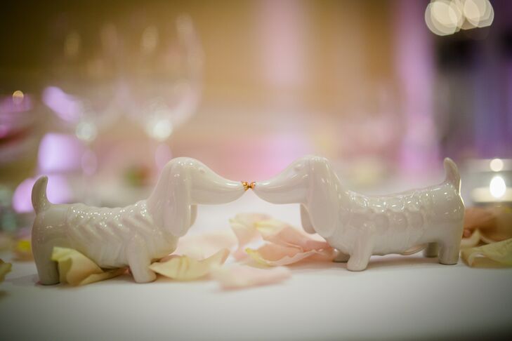 Rebecca and Jonathan incorporated elements throughout the day that spoke to their personalities and backgrounds, adding a personal dimension to the wedding decor. For their sweetheart table, the couple swapped out the standard salt and pepper shakers for white dachshund figurines, a nod to Rebecca’s family's dog, Skippy.