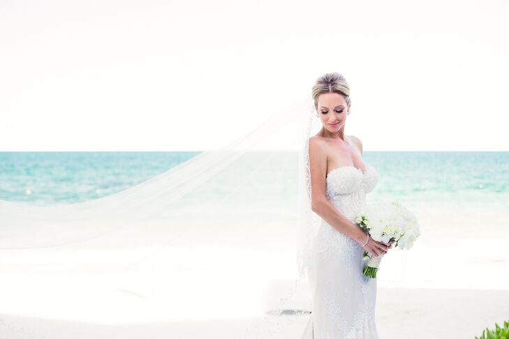 Michelle carried a full, rounded white blossom bouquet with her romantic, fitted Inbal Dror strapless gown.