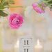 Vintage playing cards were used at the table numbers and were held up by spools of pink thread.