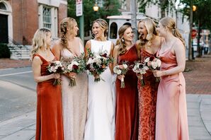 Bride in Bateau-Neck Dress With Brides in Champagne, Red and Blush Dresses