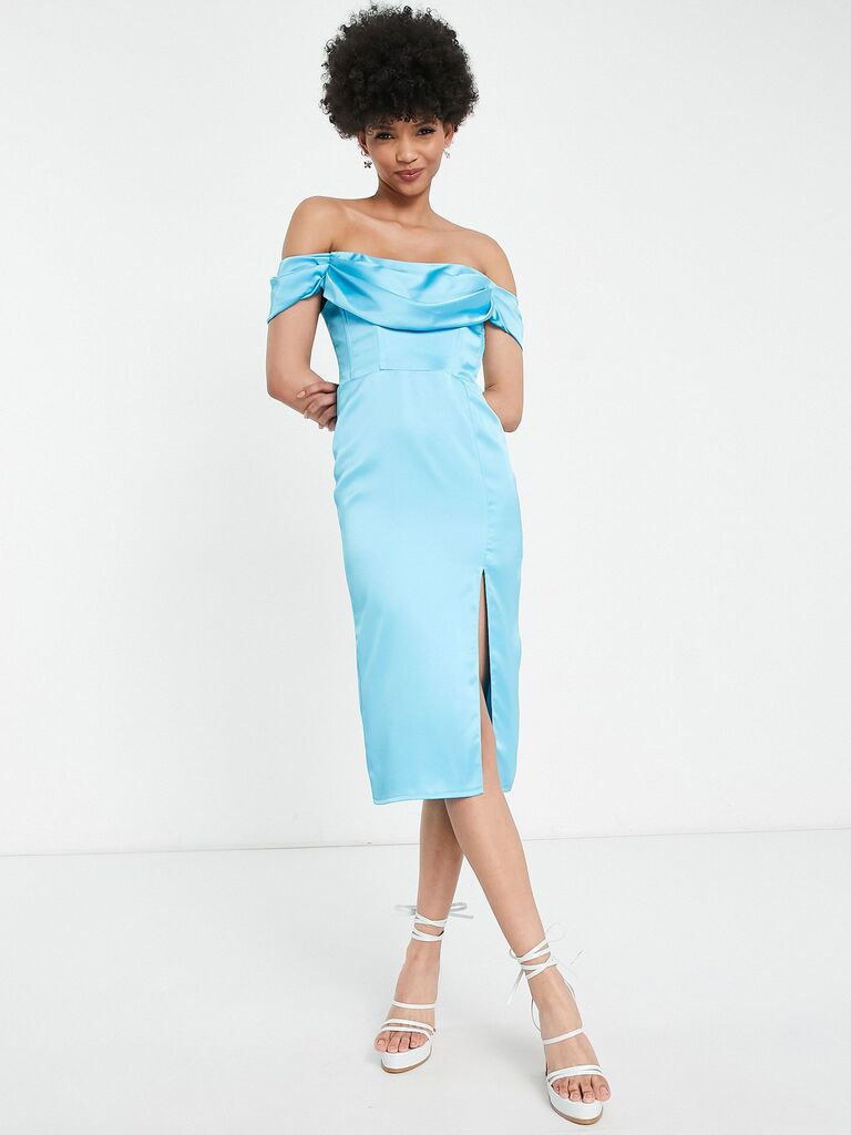 A model wears this lovely off-the-shoulder pale blue gown.