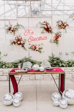 Sweetheart Table with Neon Sign, Disco Balls and Burgundy Table Runner