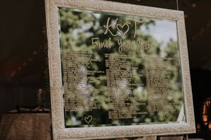 Mirrored Seating Chart Display with Gold Calligraphy