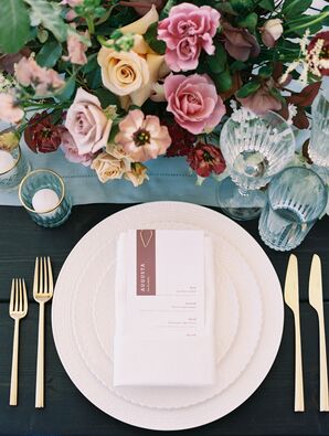 Place Setting With Gold Flatware, Cream Dishes and Blue Table Runner