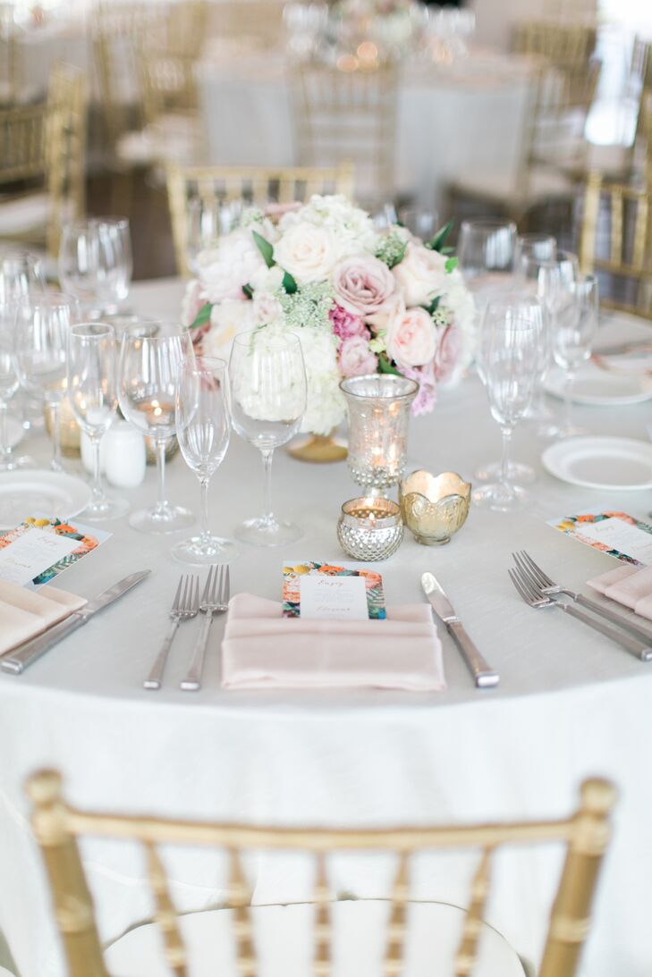 At the tented reception, each table was topped with white tablecloths and tall or short glass vases bursting with peonies, roses and hydrangeas. "We had mercury-glass candles on every table," Bree says. "This also helped to create the romantic ambience."