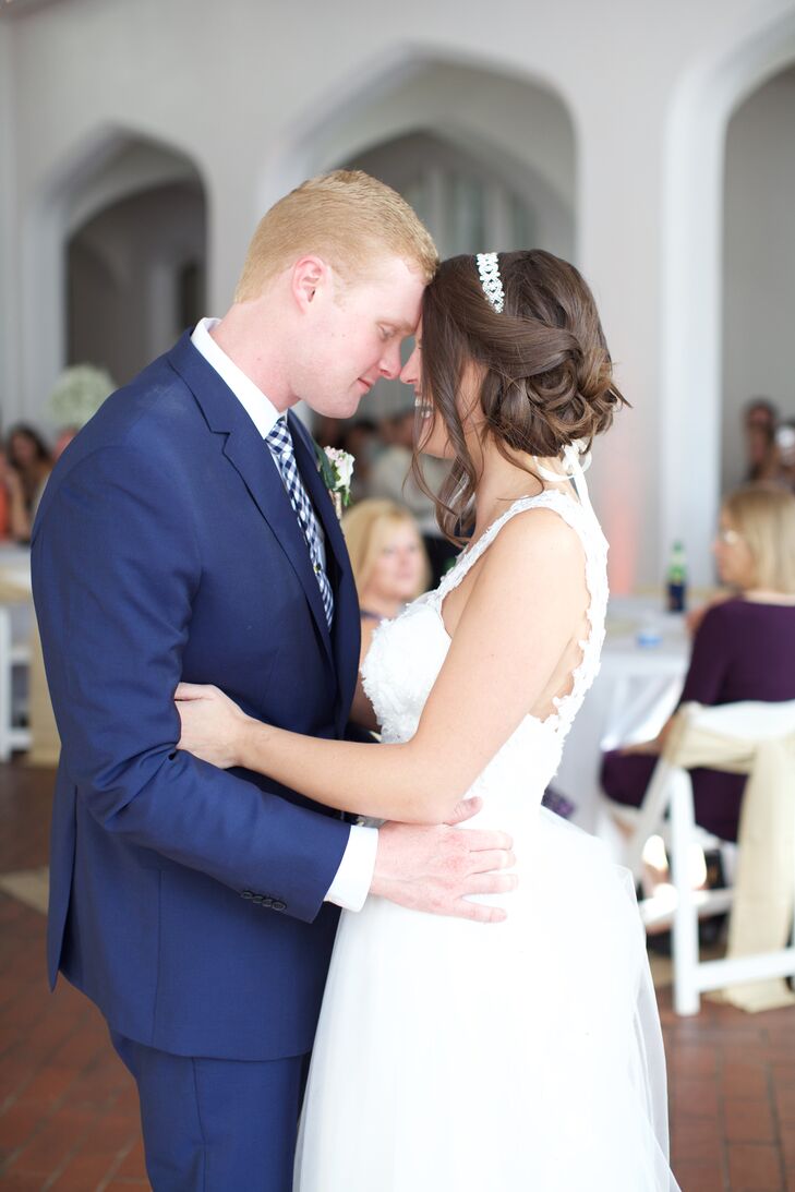 Nick wore a blue Banana Republic suit, which he paired with a blue gingham tie. He and his groomsmen wore suspenders and colorful socks for a whimsical touch.