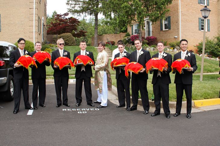 The groomsmen wore traditional black tuxedos, gold ties and white boutonnieres to the wedding. Joe changed into a traditional gold outfit for the Vietnamese tea ceremony.