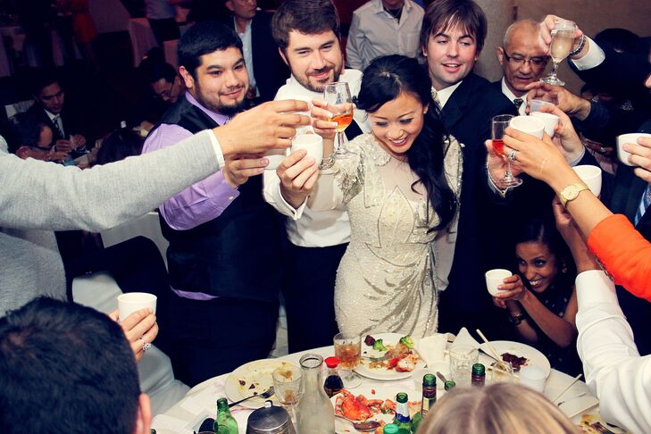 Natalie changed into her mother's vintage couture dress for the reception. At each table, guests were given lucky pennies and scratch cars to see if they could win a bottle of cognac.