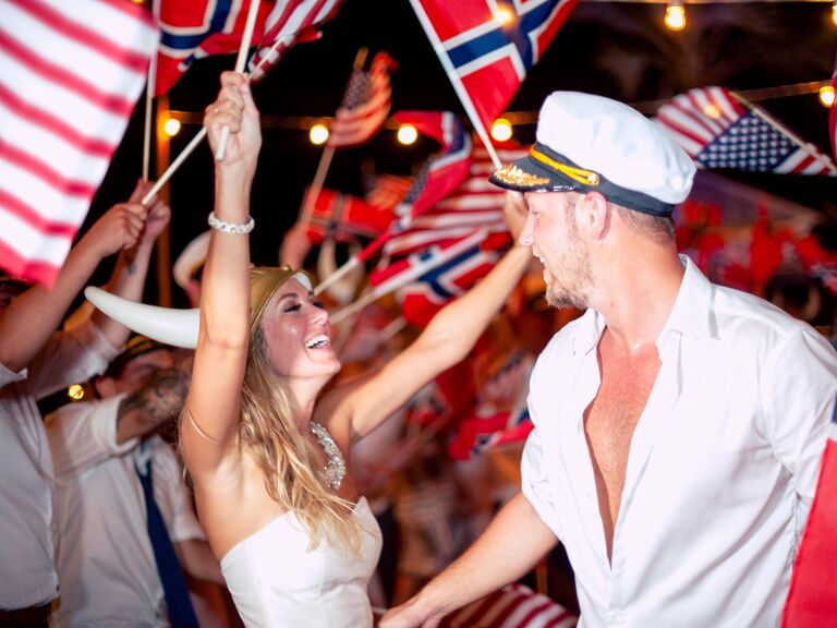 Country flags waved during the couple's wedding exit. 