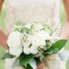 The bridesmaids carried arrangements of white astilbe, roses and lisianthus.