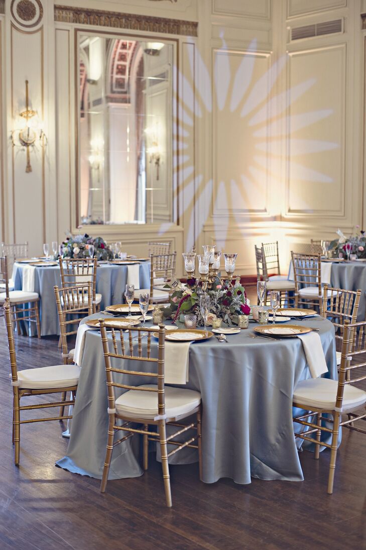The tables were topped in mint green, matte satin tablecloths and set with gold chargers for a bit of glamour. Each centerpiece was different but all contained peonies, roses, protea, dusty miller, eucalyptus and brunia berries.