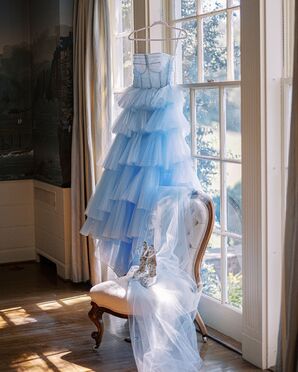 Blue Ruffled Wedding Dress Hanging in Window
