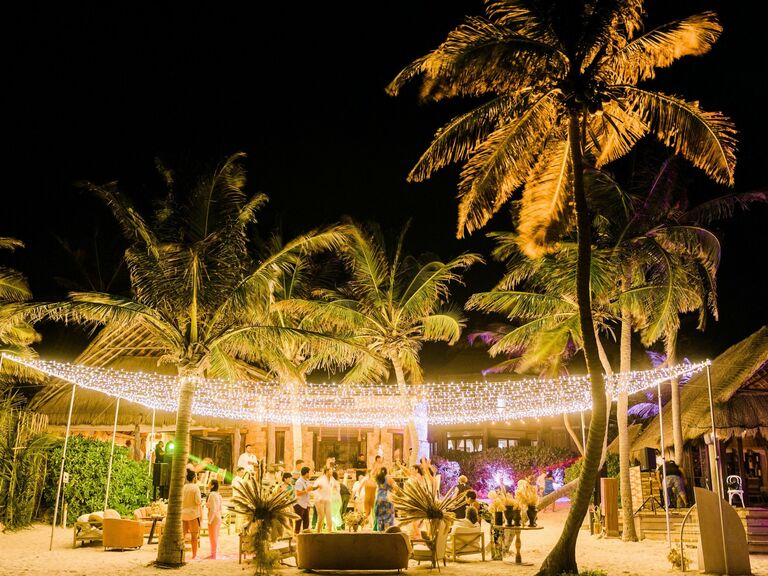 Draped string lights over a dance floor. 