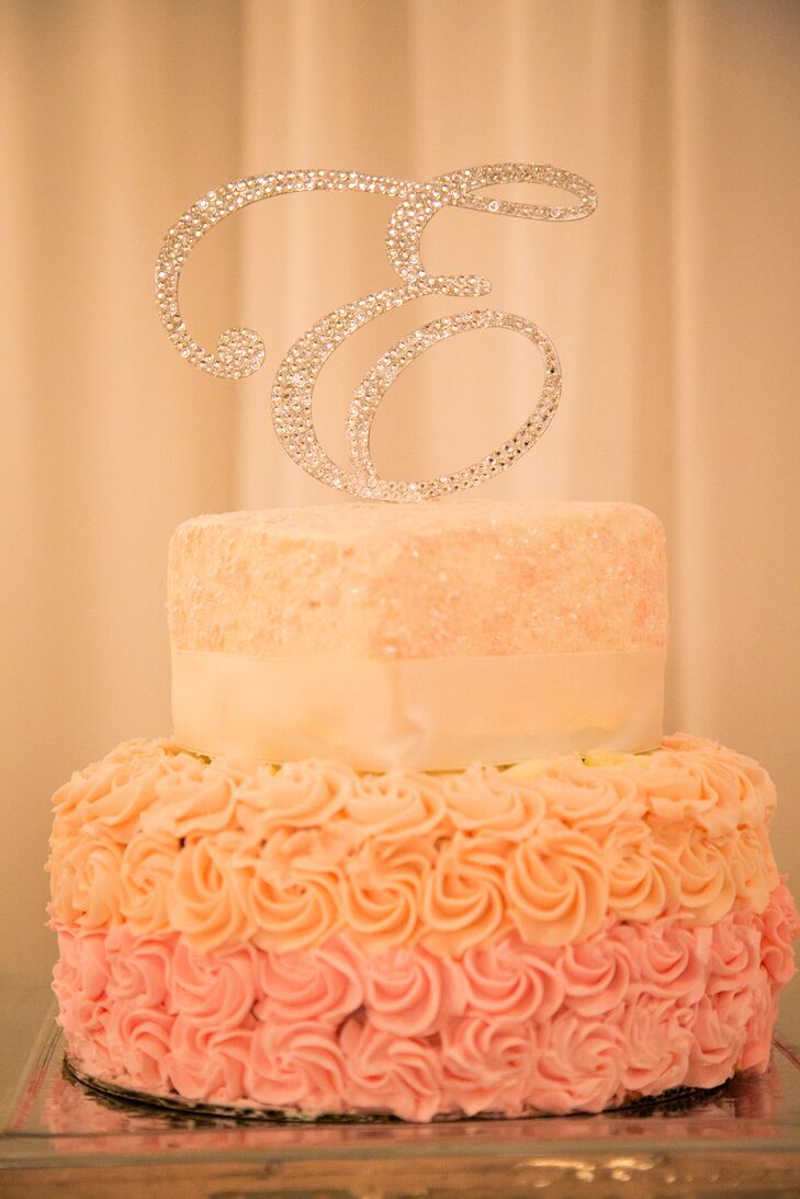 “The wedding cake was served as a 3” miniature wedding cake for each guest, with a heart shaped Sweetheart cake for the bride and groom and a rhinestone "E" as the topper," says Kelli.
