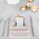 Colorful floral menus sat atop blush pink napkins under the glow of gold and silver votives. "We had mercury-glass candles on every table, I love mercury glass and lots and lots of candles," Bree says. "This also helped to create the romantic ambience."