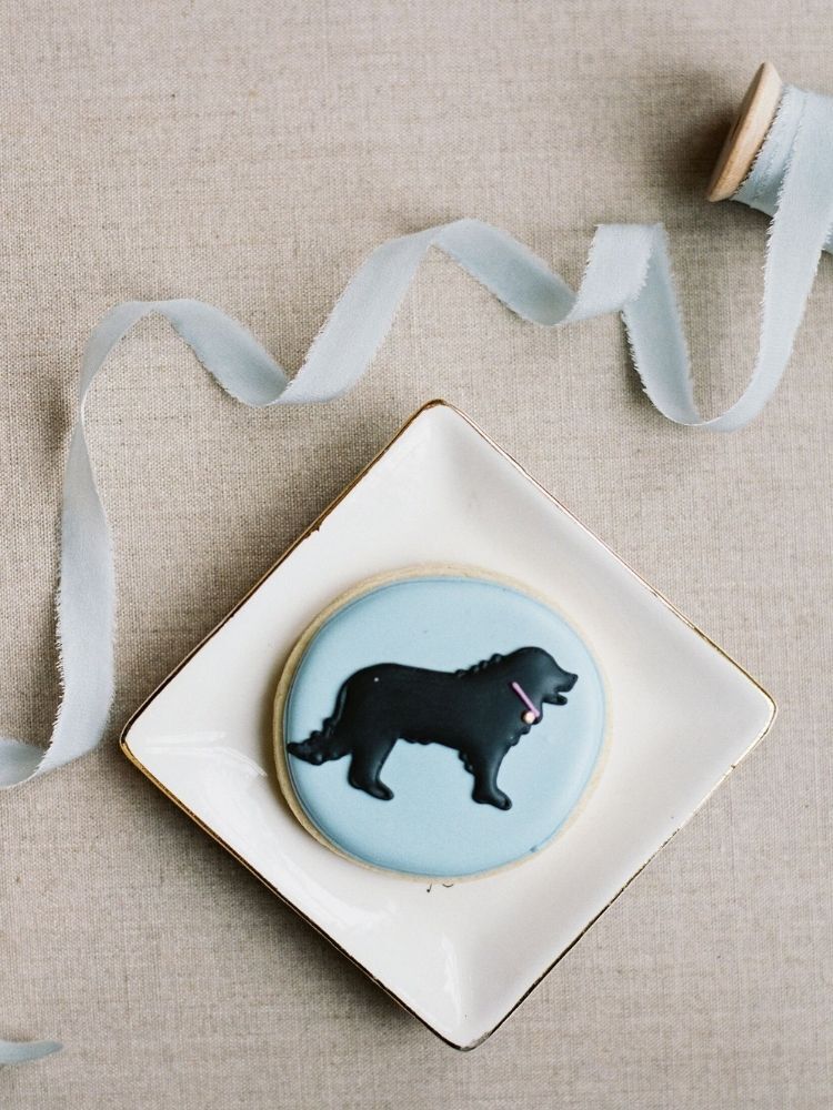 blue cookie decorated with dog illustration
