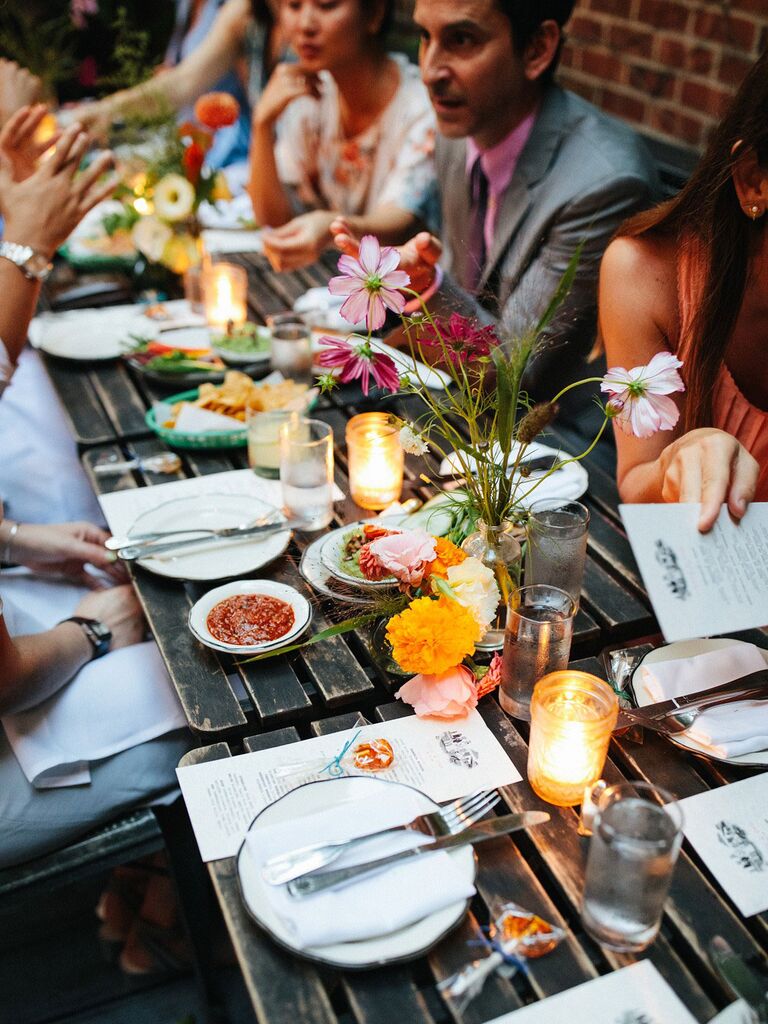 Guests chatting across bridal shower brunch tablescape