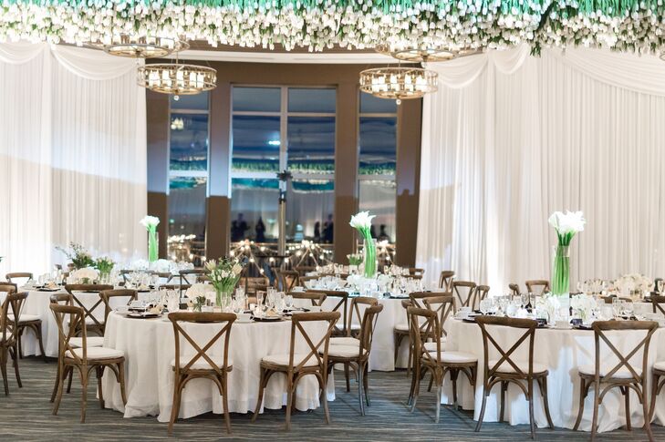 When looking for decor ideas, Mary fell in love with a statement piece of white tulips hanging upside down from the ceiling at the Edgewater in Madison, Wisconsin. “They looked beautiful, and I truly felt like my grandparents were there in spirit, an influential part of our day,” she says.
