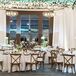 When looking for decor ideas, Mary fell in love with a statement piece of white tulips hanging upside down from the ceiling at the Edgewater in Madison, Wisconsin. “They looked beautiful, and I truly felt like my grandparents were there in spirit, an influential part of our day,” she says.