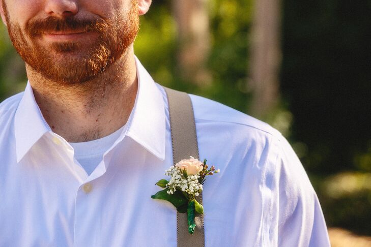 The boutonnieres were a mix of a small blush rose and baby’s breath that matched both Francesca's larger bridal bouquet and the full baby's breath bridesmaid bouquets.