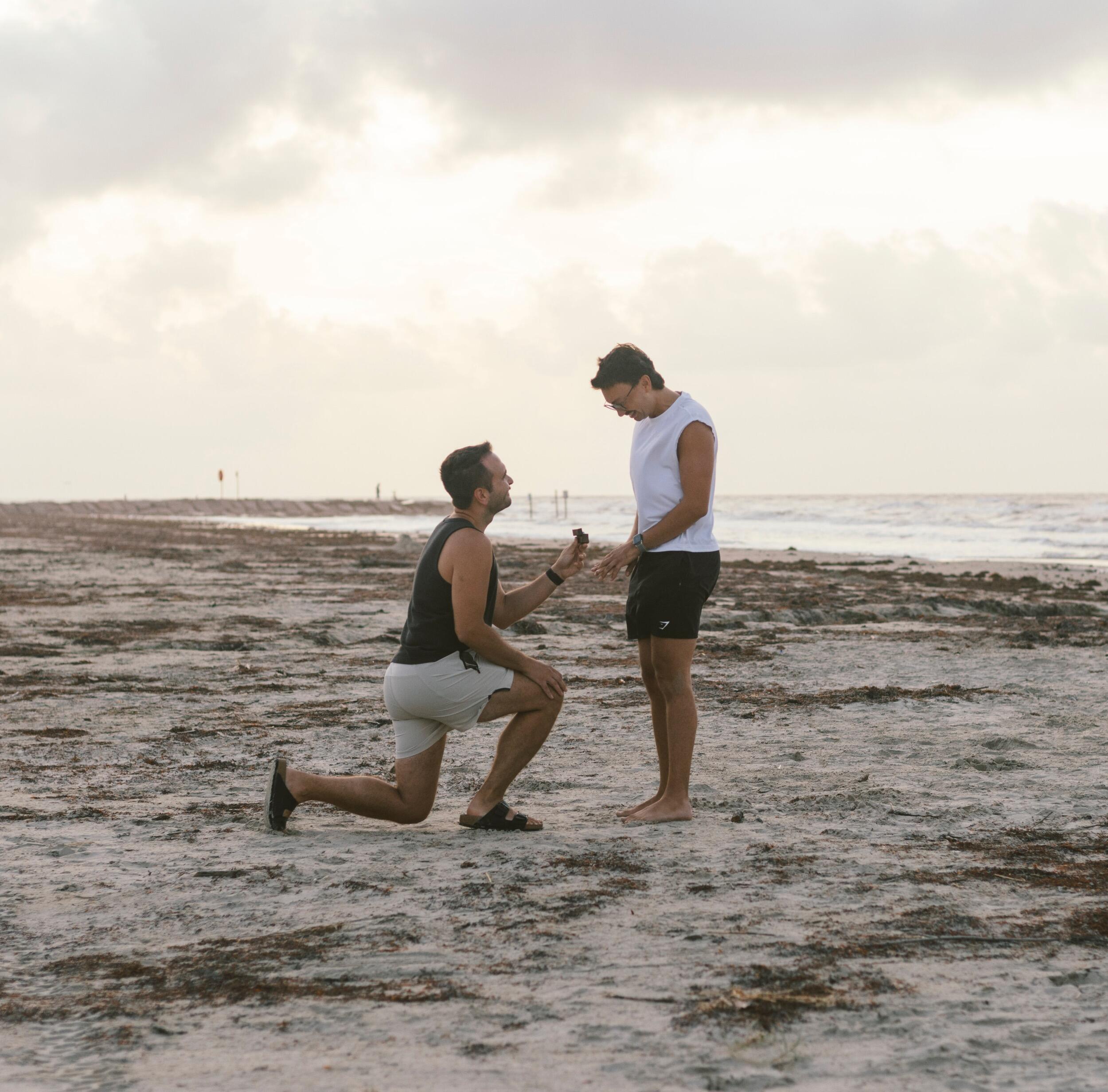 On a weekend trip to Galveston Beach, Kevin surprised Justin with a sunrise proposal on the beach!
