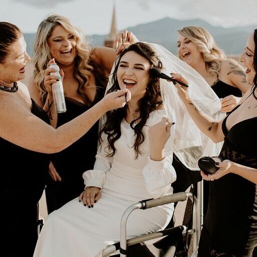 Bride and her bridesmaids in a silly pose for her Colorado wedding. 