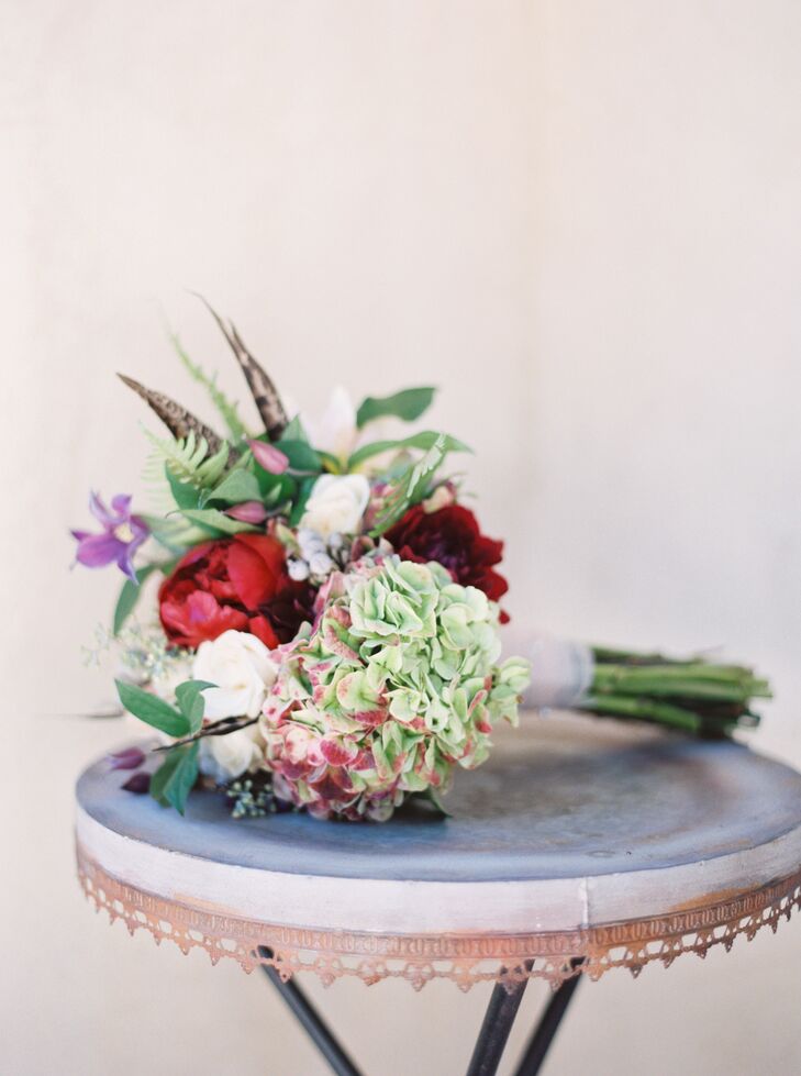 Ann carried a bouquet that she arranged with her bridesmaids, using pesticide-free blooms donated by a service that the florist worked with. This served as an affordable and eco-friendly way to bring flower arrangements to the wedding.