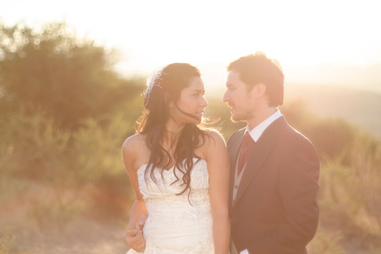 A couple gaze lovingly into each other's eyes.