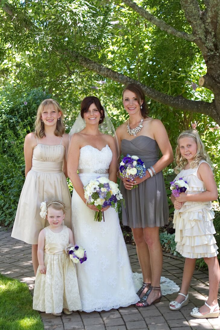 Jen chose a short gray J Crew dress with a sweetheart neckline for her maid of honor. The flower girls wore a mix of knee-length champagne colored dresses.