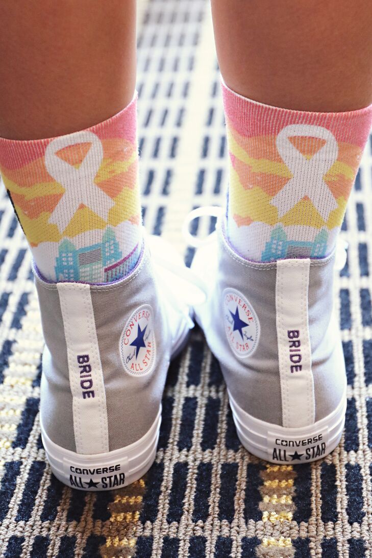 “We made sure that we had our matching 'bride' Converse shoes on the whole night,” Cassandra says. “Best decision ever!”  They paired their sneakers with Orlando pride socks to commemorate the Pulse nightclub victims.