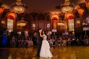 Bride and Groom at First Dance in Glamorous Ballroom